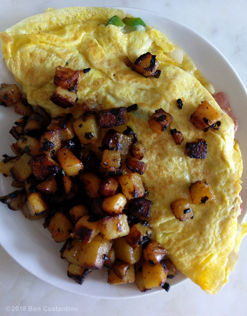 Homefries with a Denver omelette.