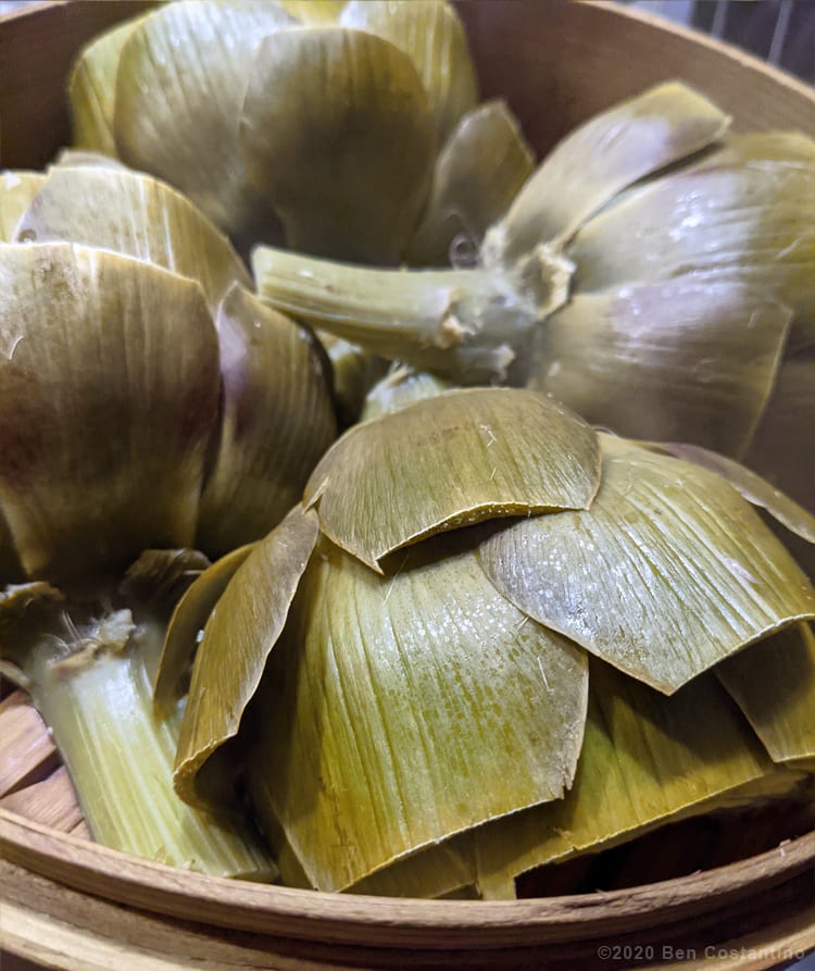 steamed artichokes in a bamboo steamer