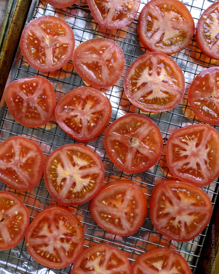 sliced tomatoes on a baking rack