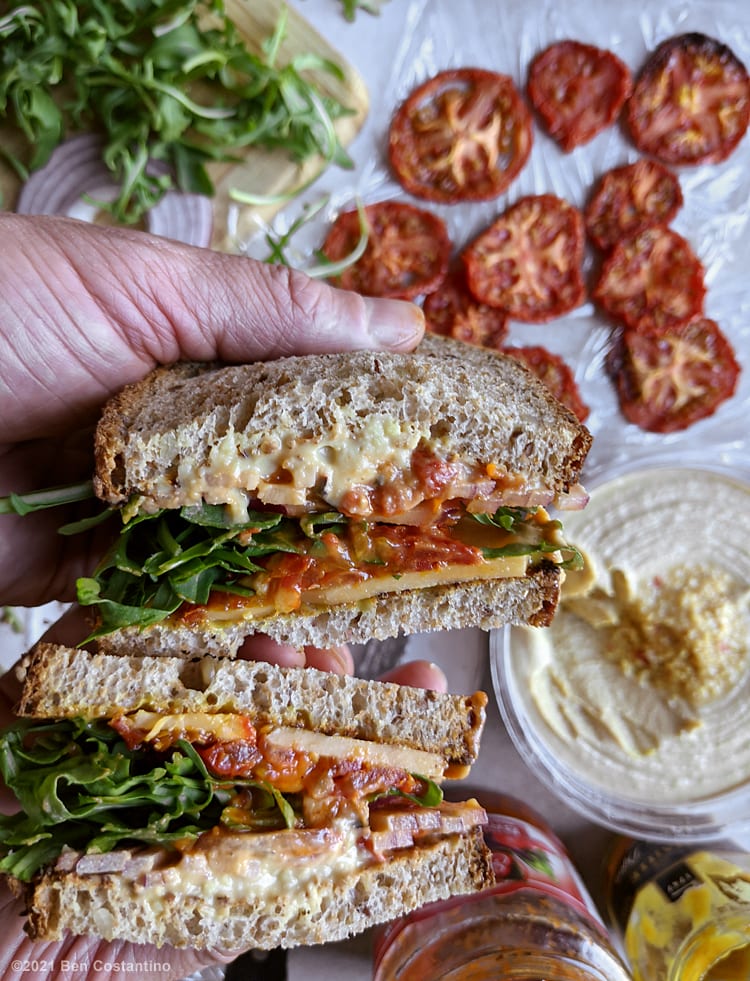 oven-dried tomato slices in a sandwich
