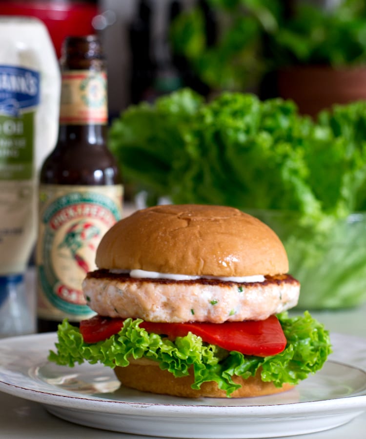 salmon burger with olive oil mayo, lettuce and red pepper