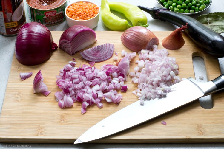 chopped onions and veggies with thai curry paste