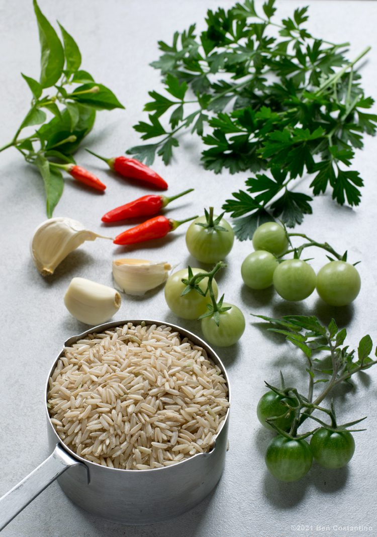 ingredients brown rice, green tomatoes, garlic, tabasco peppers, and parsley