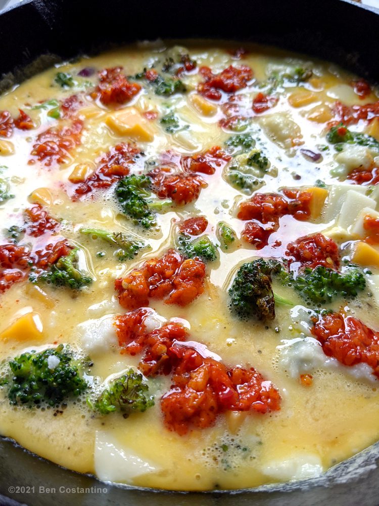 skordalia and calabrian peppers in a frittata